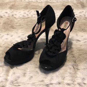 Black heels with cute straps along top of foot